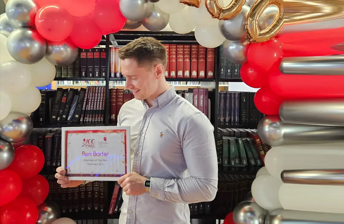 Ben Barter holding an award